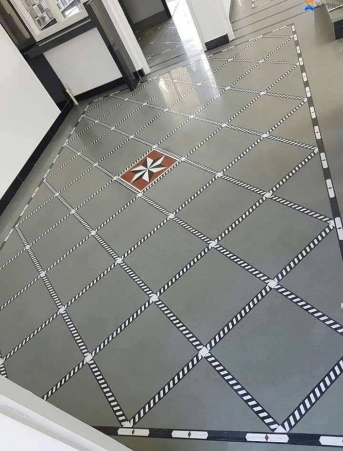 Elegant grey flooring design with a decorative border