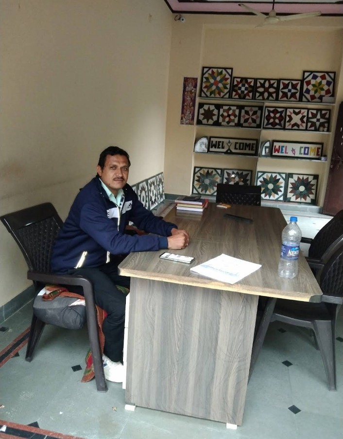 Proprietor at his desk in the office